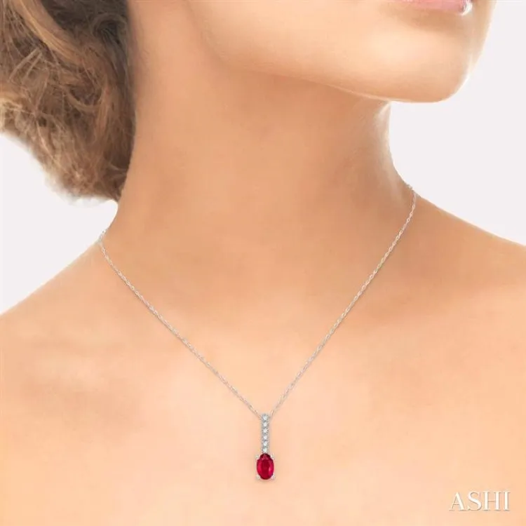 1/20 Ctw Round Cut Diamond and Oval Cut 6x4 MM Ruby Precious Pendant in 10K White Gold with chain