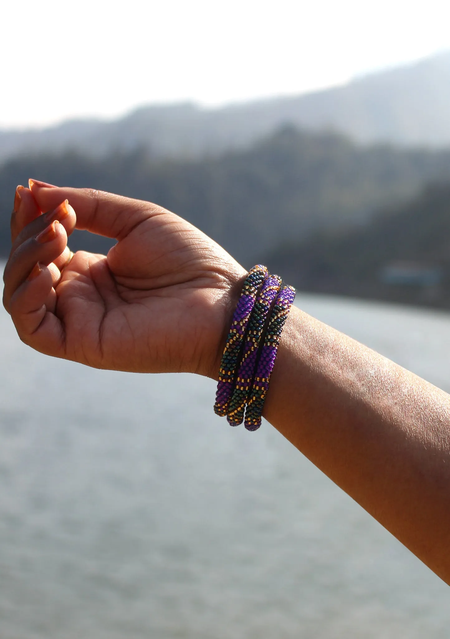 Bright Purple and Golden Beads Nepalese Roll on Bracelet